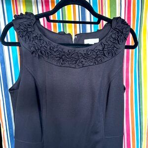 Never worn!  Little black dress with beautiful neckline.